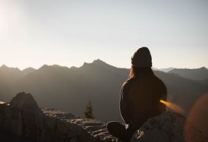 woman meditating in mountain
